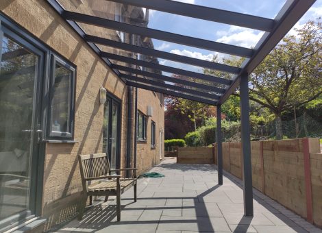 Glass patio veranda installed by dencas blinds in cheshire